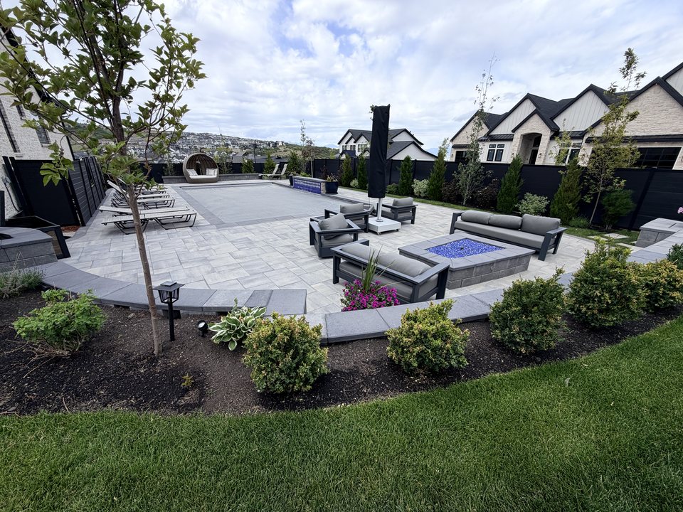 Custom hardscape outdoor living area with lounge seating