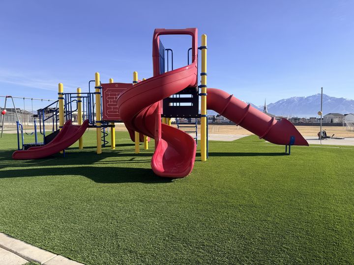 Kid 2 Kid Turf project by EverBlade Designs — commercial playground slide on turf