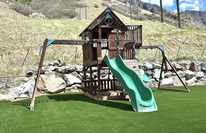 Kid 2 Kid Turf project by EverBlade Designs — mountainside playhouse and swing set