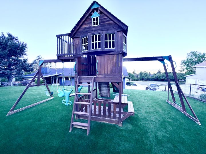 Kid 2 Kid Turf project by EverBlade Designs — backyard playhouse with dual swing sets