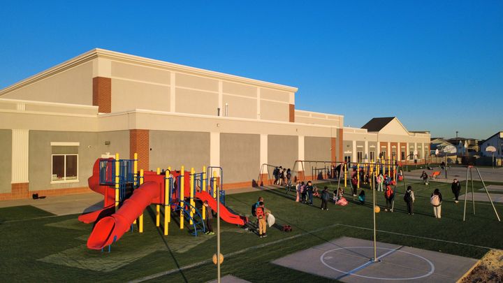 Aerial view of a school playground turf installation by EverBlade Designs