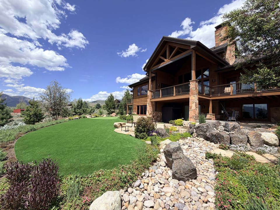 Custom turf lawn around a mountain cabin