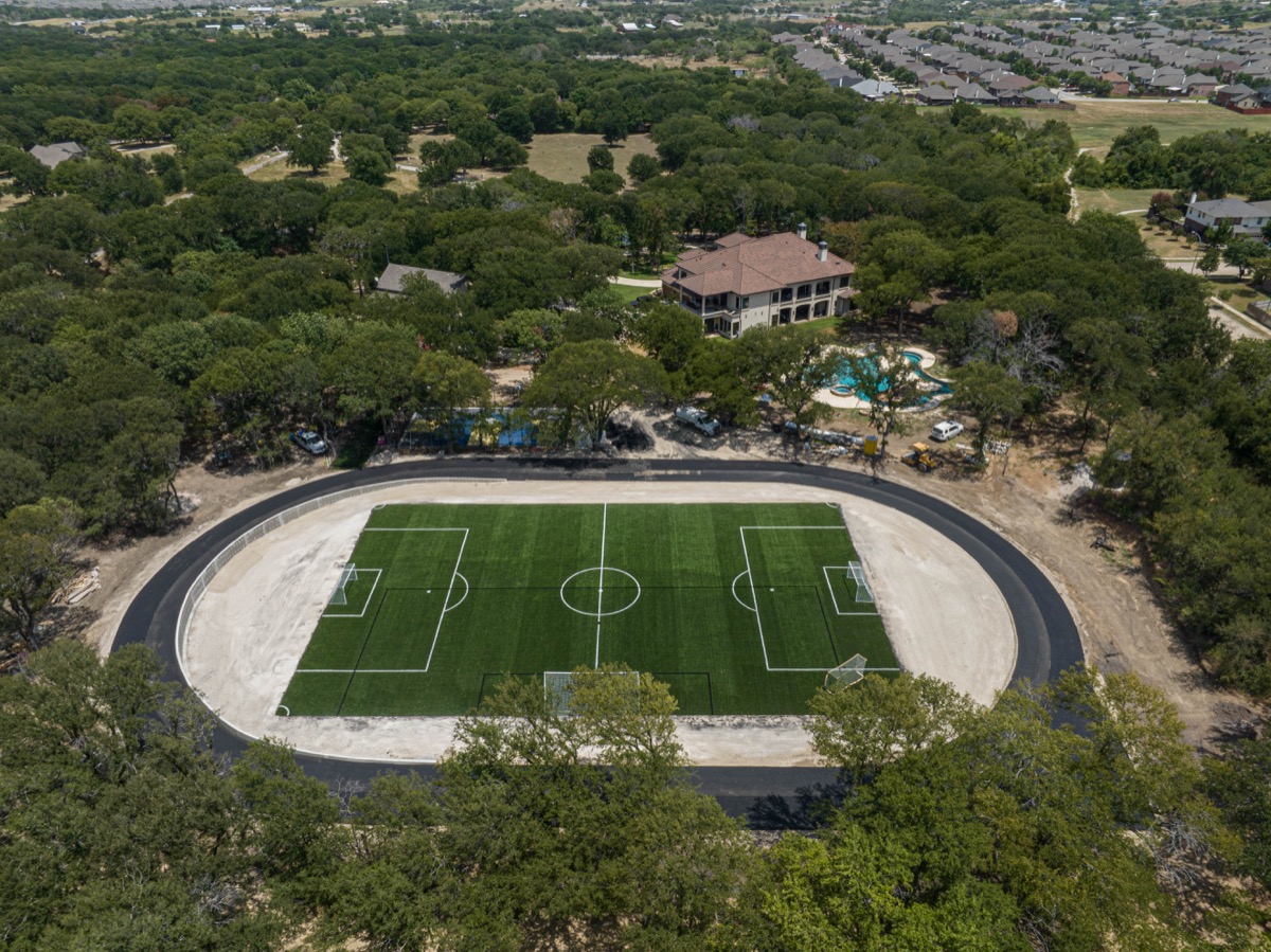Aerial view of a completed synthetic soccer field installation