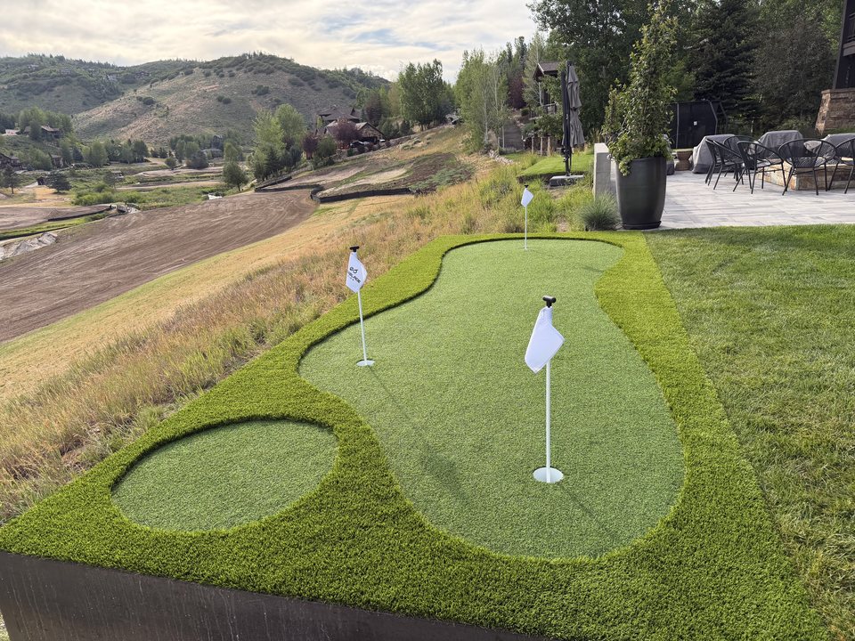 Hillside putting green with mountain views